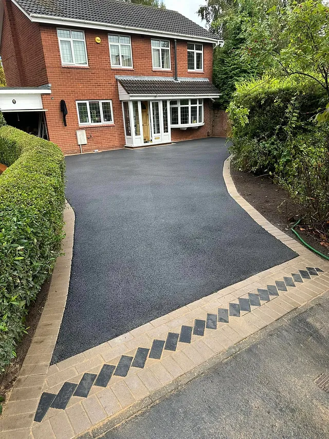 Tarmac driveway with cream block paved edging